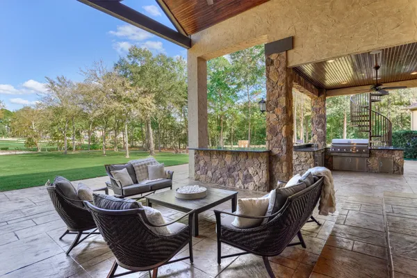 a patio with patio a couch and chairs