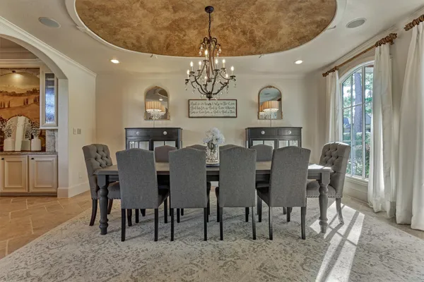 a kitchen with granite countertop a sink stove and cabinets