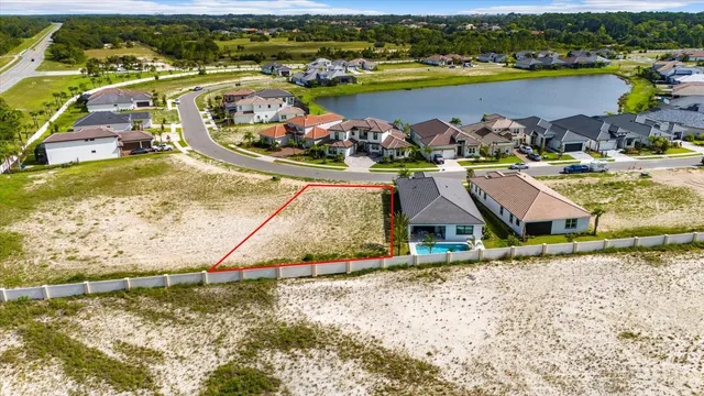 a view of a wooden fence and a big yard