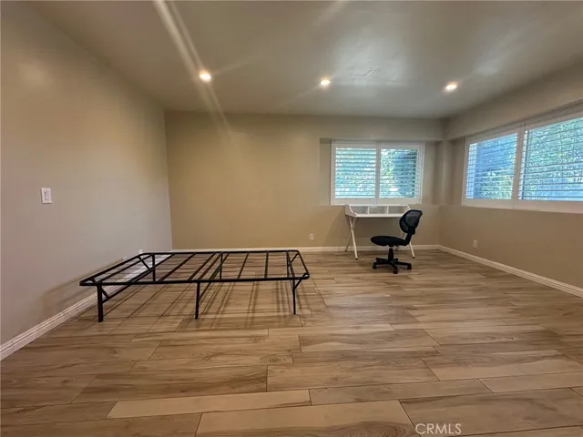 a room with gym equipment and a window