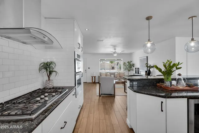 a kitchen with counter top space appliances and cabinets