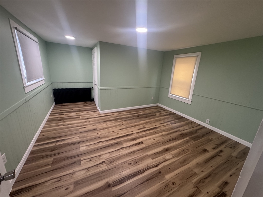 2 Wall Court Maynard, MA 01754 - Photo 7 of 11 a view of empty room with wooden floor