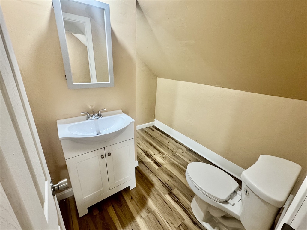 2 Wall Court Maynard, MA 01754 - Photo 9 of 11 a bathroom with a sink mirror vanity and toilet