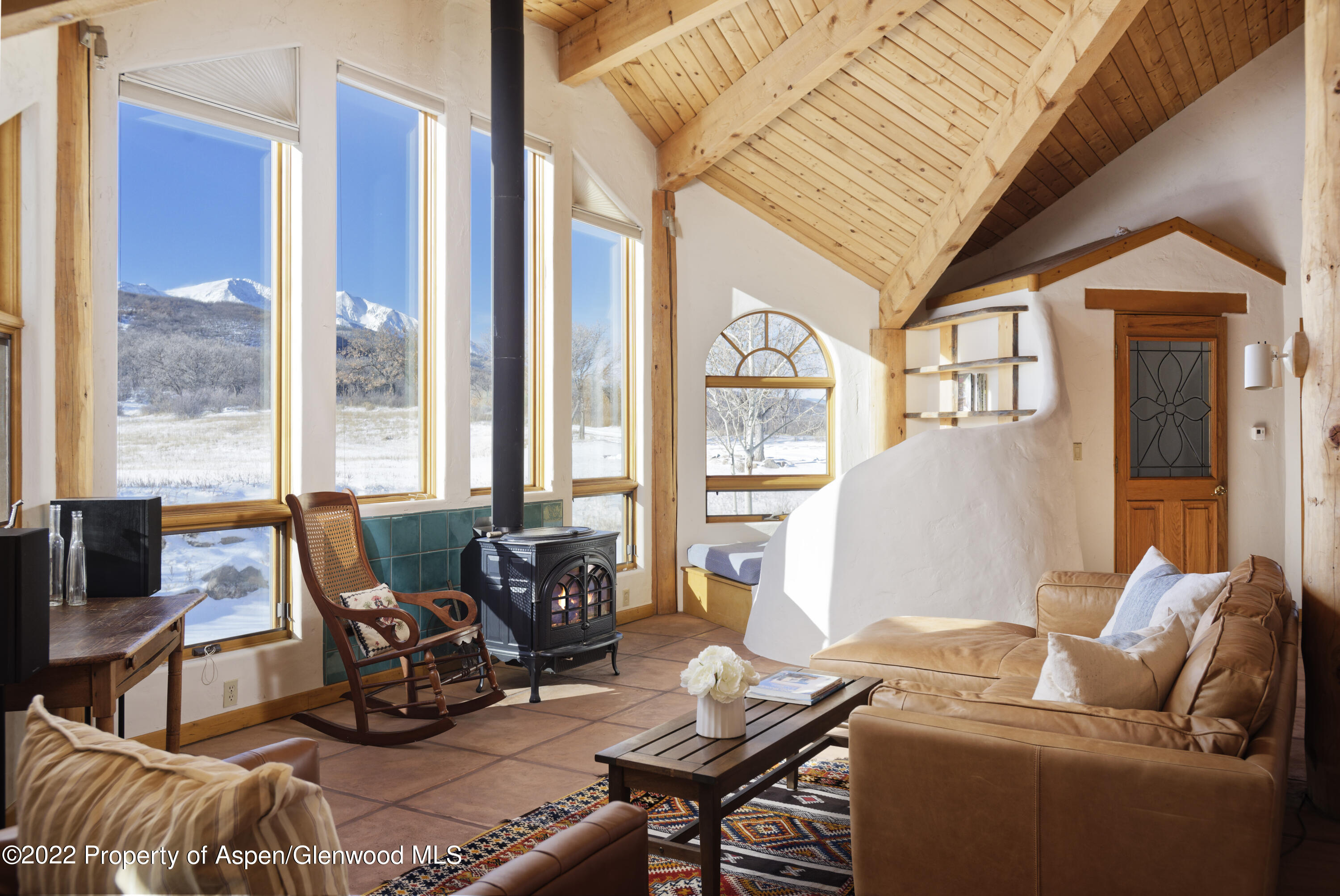 2651 Bear Ridge Road Basalt, CO 81621 - Photo 11 of 16 a living room with furniture and floor to ceiling windows
