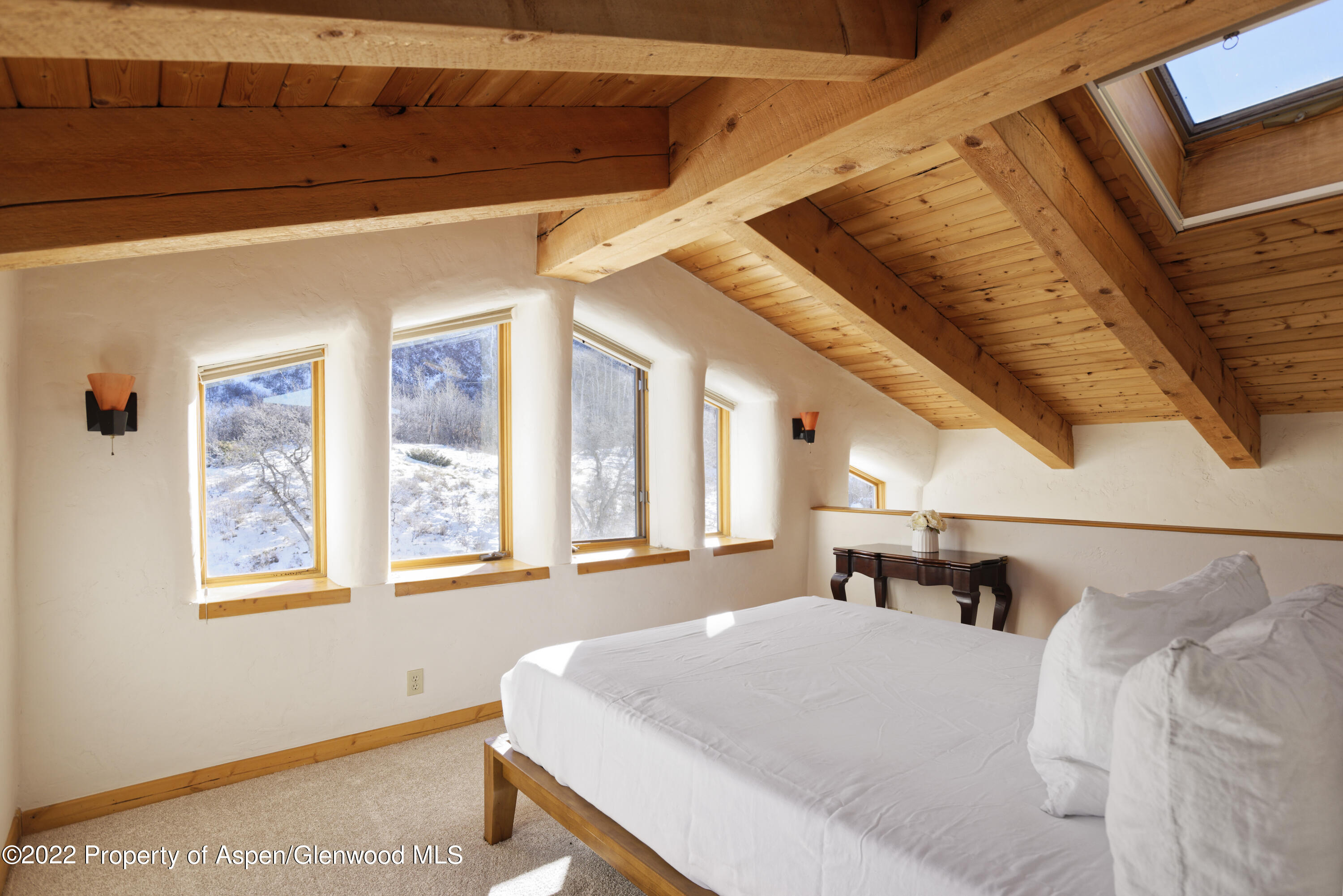 2651 Bear Ridge Road Basalt, CO 81621 - Photo 14 of 16 a bed sitting in a bedroom next to a window