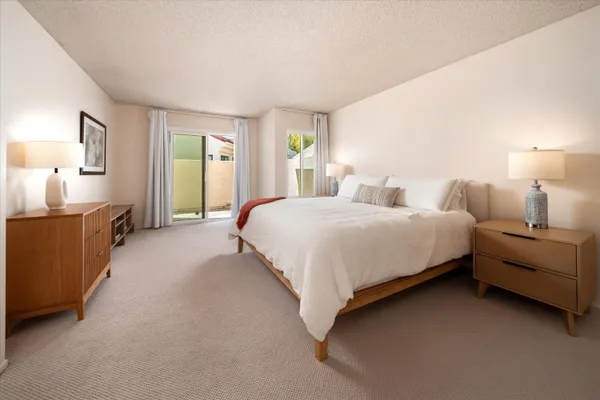 a bedroom with bed and window
