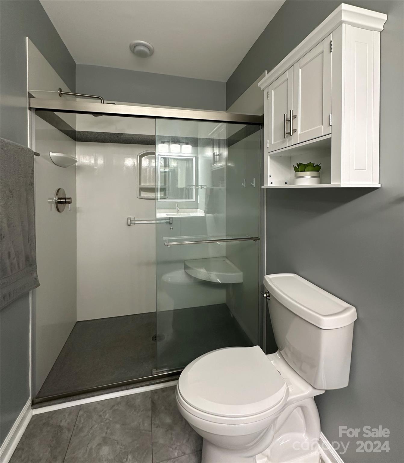 11330 Stone Trail Road Charlotte, NC 28213 - Photo 14 of 24 a bathroom with a toilet and a shower
