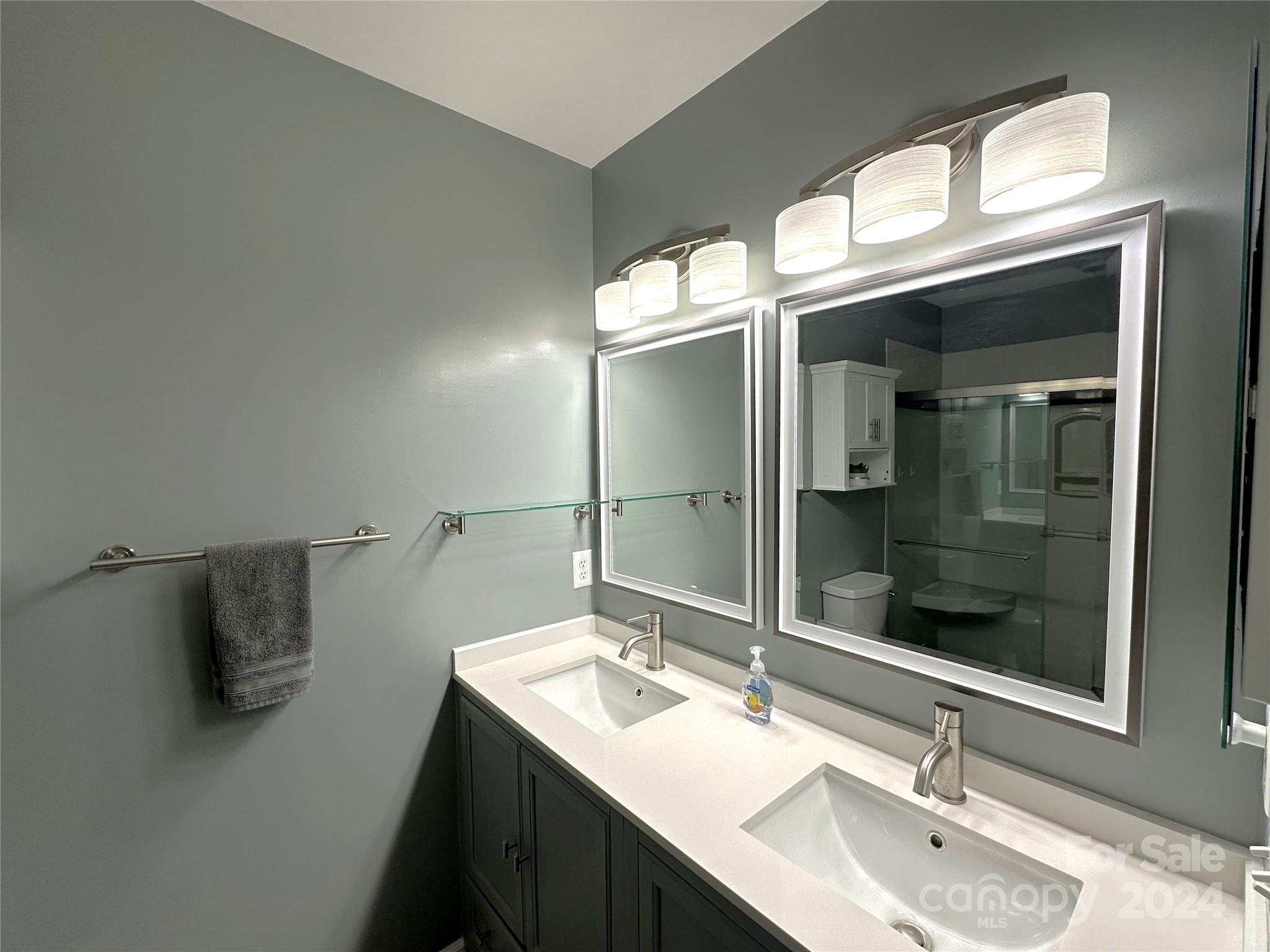 11330 Stone Trail Road Charlotte, NC 28213 - Photo 15 of 24 a bathroom with a sink and a mirror