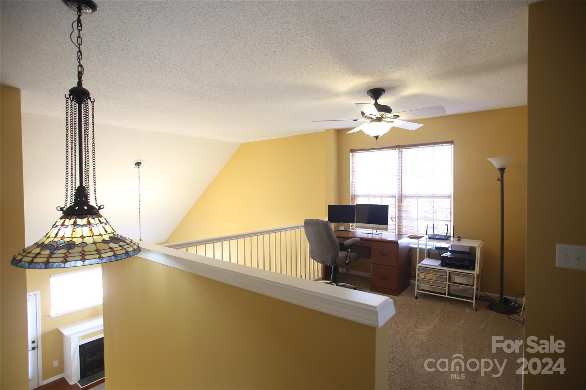 11330 Stone Trail Road Charlotte, NC 28213 - Photo 16 of 24 a view of a workspace with furniture and a window
