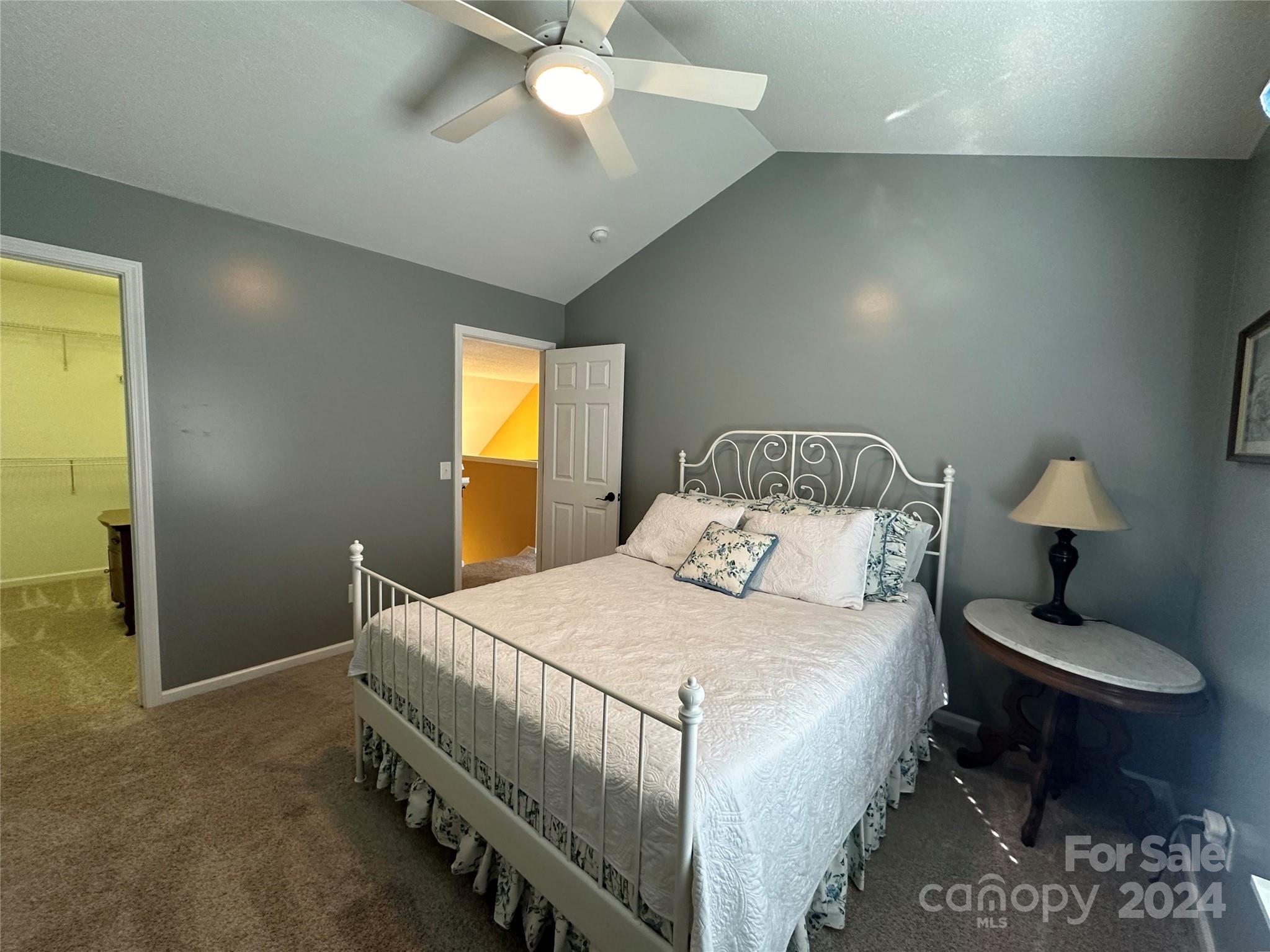 11330 Stone Trail Road Charlotte, NC 28213 - Photo 18 of 24 a bedroom with a bed and a chandelier