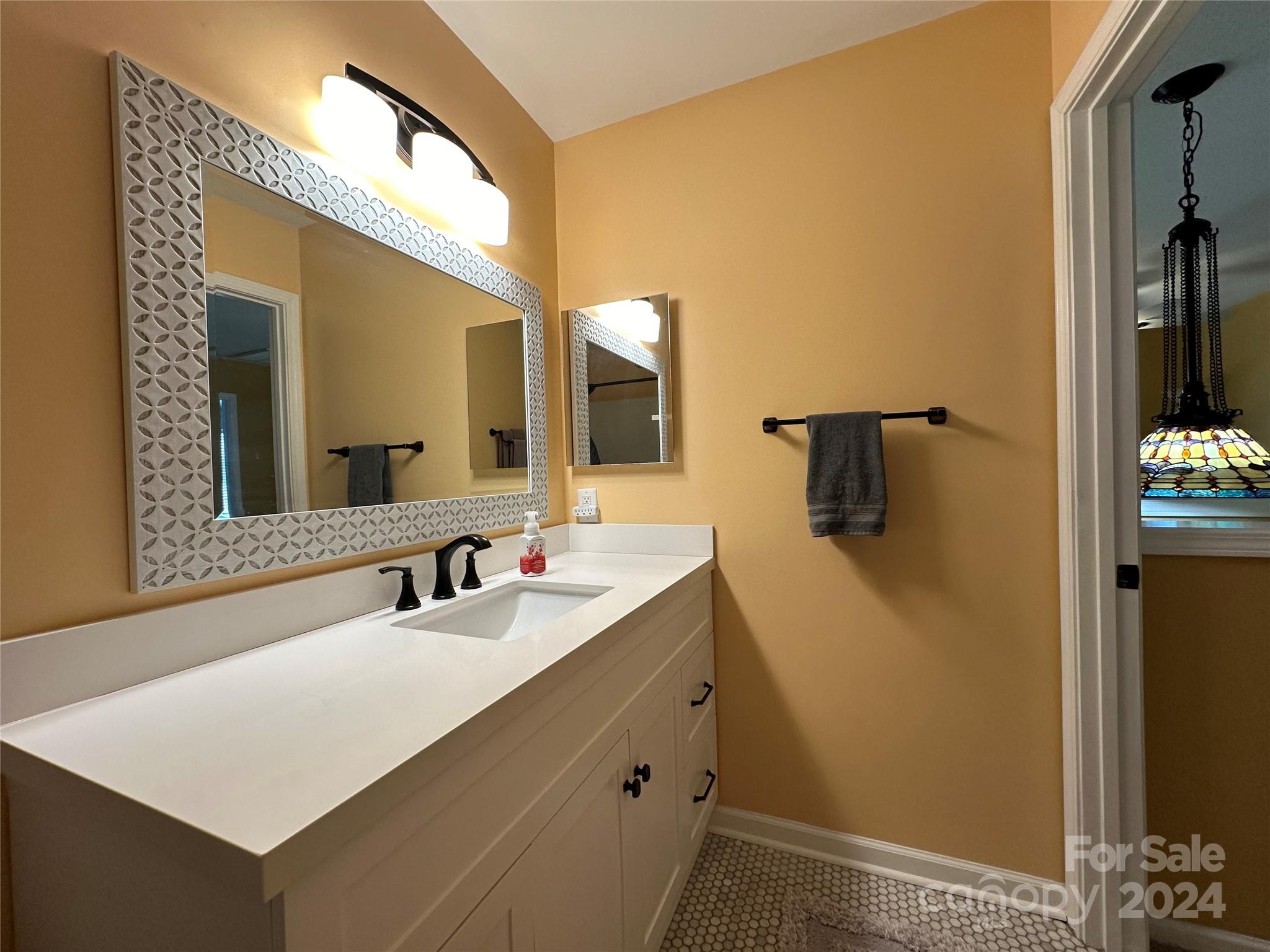 11330 Stone Trail Road Charlotte, NC 28213 - Photo 21 of 24 a bathroom with a sink a mirror and a shower