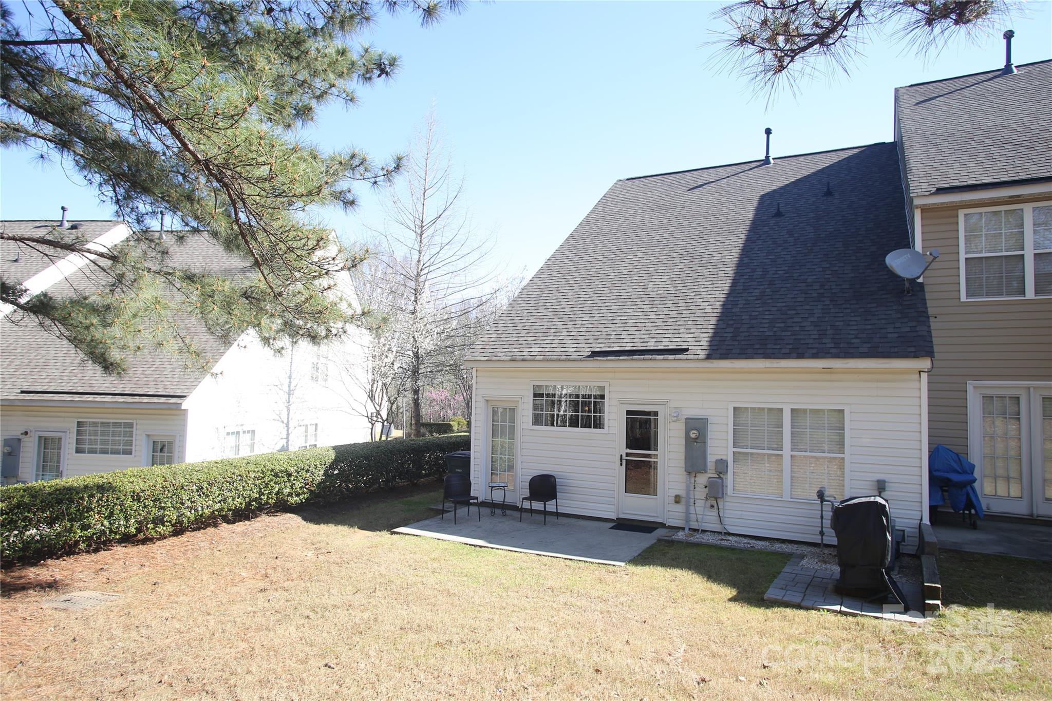 11330 Stone Trail Road Charlotte, NC 28213 - Photo 22 of 24 a front view of a house with a yard covered in snow