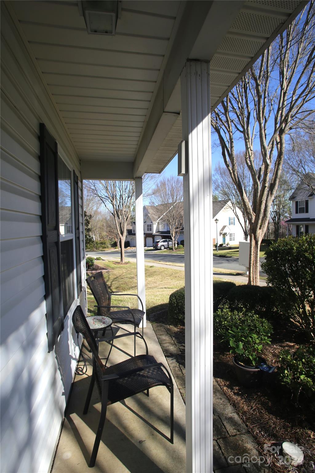 11330 Stone Trail Road Charlotte, NC 28213 - Photo 4 of 24 a view of a patio with table and chairs next to a yard