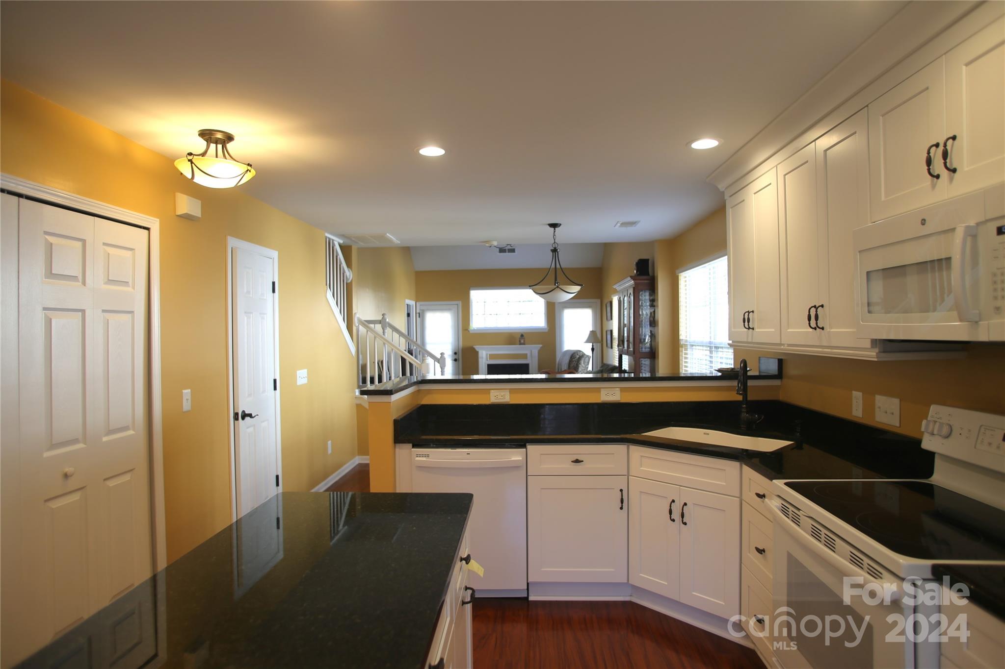 11330 Stone Trail Road Charlotte, NC 28213 - Photo 7 of 24 a large kitchen with granite countertop a large counter top appliances and cabinets