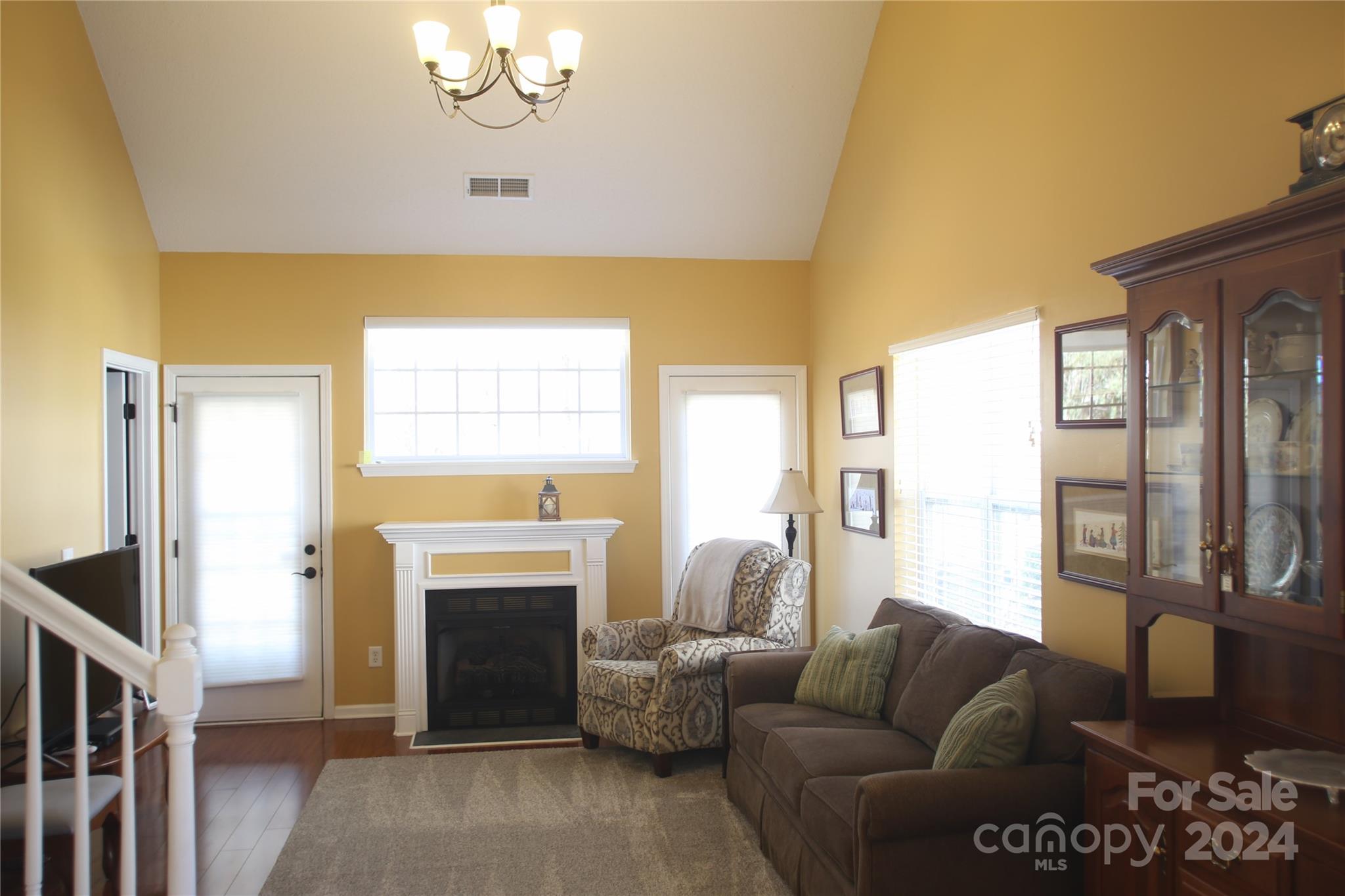 11330 Stone Trail Road Charlotte, NC 28213 - Photo 10 of 24 a living room with furniture a large window and a fireplace