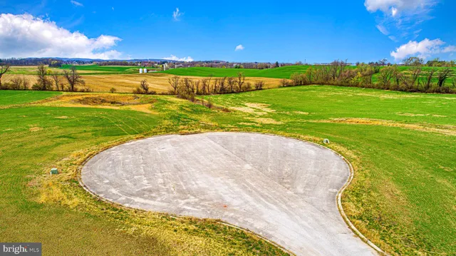 a view of a swimming pool with a yard