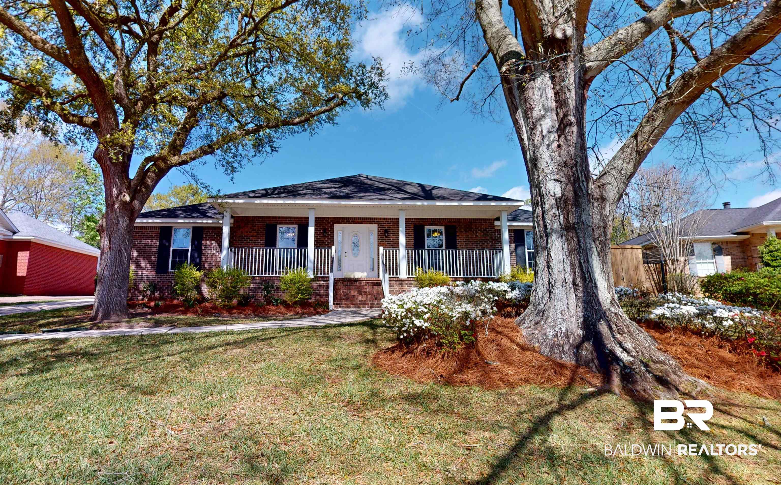 7310 Cheryl Court Mobile, AL 36695 - Photo 1 of 23 Ranch-style house with a porch, brick siding, and a front lawn