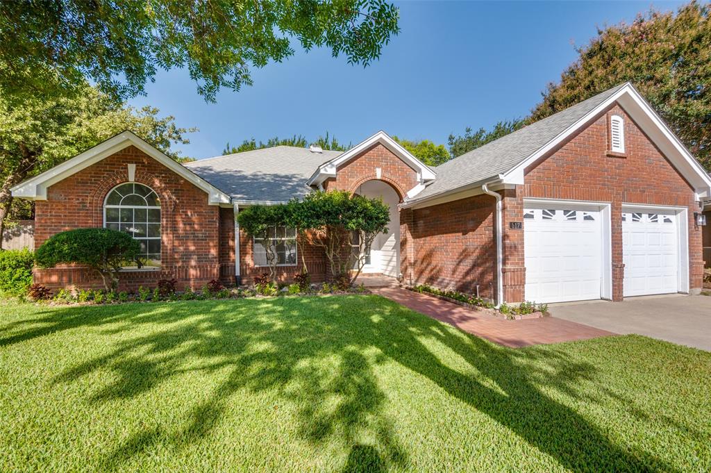 517 Aurora Court Euless, TX 76039 - Photo 1 of 1 a view of a house with a big yard potted plants and large tree