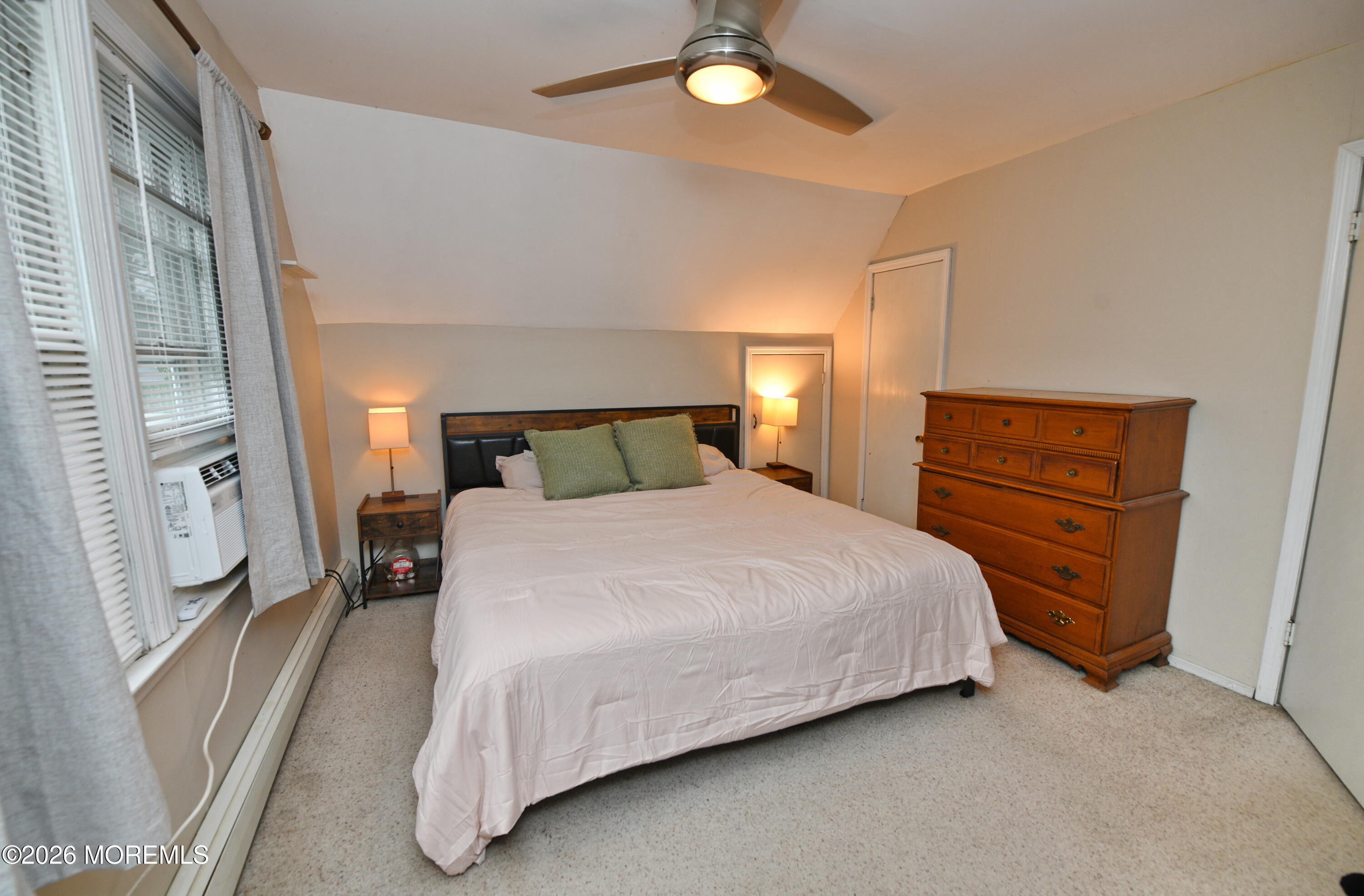 232 Pearce Avenue Point Pleasant, NJ 08742 - Photo 14 of 27 a bedroom with a bed and wooden floor