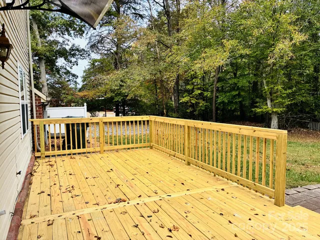 a view of balcony with wooden floor