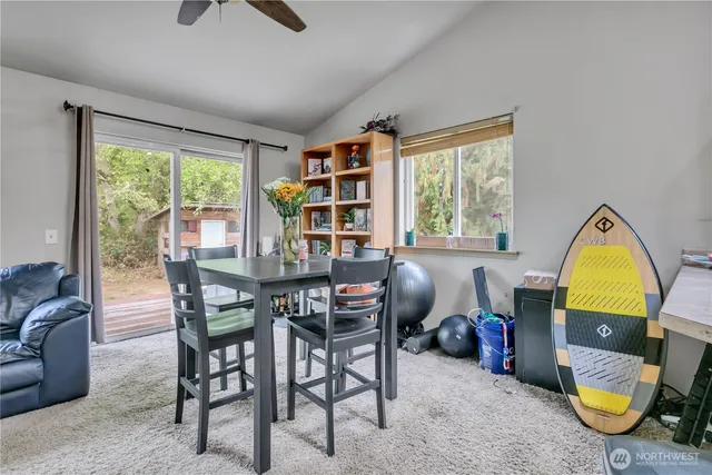 a view of a dining room with furniture window and outside view
