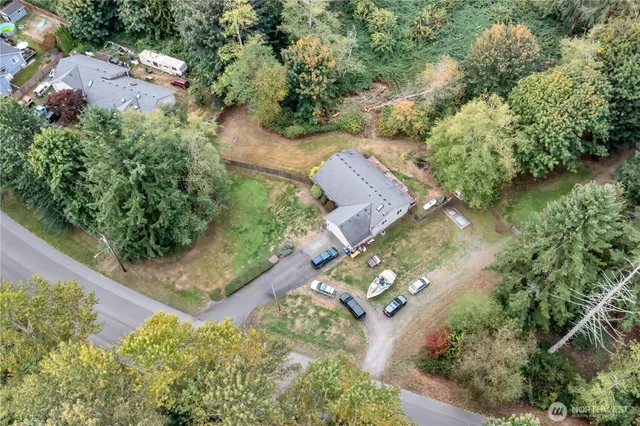 an aerial view of a house with a yard