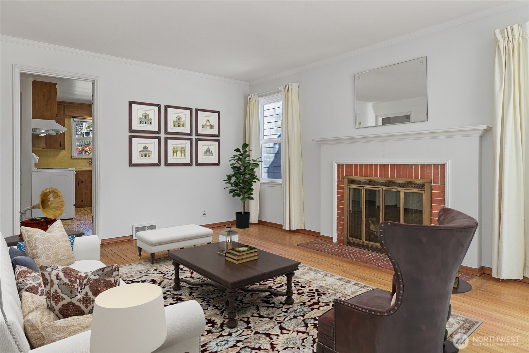 4437 47th Avenue Southwest Seattle, WA 98116 - Photo 12 of 39 a living room with furniture a table and a fireplace