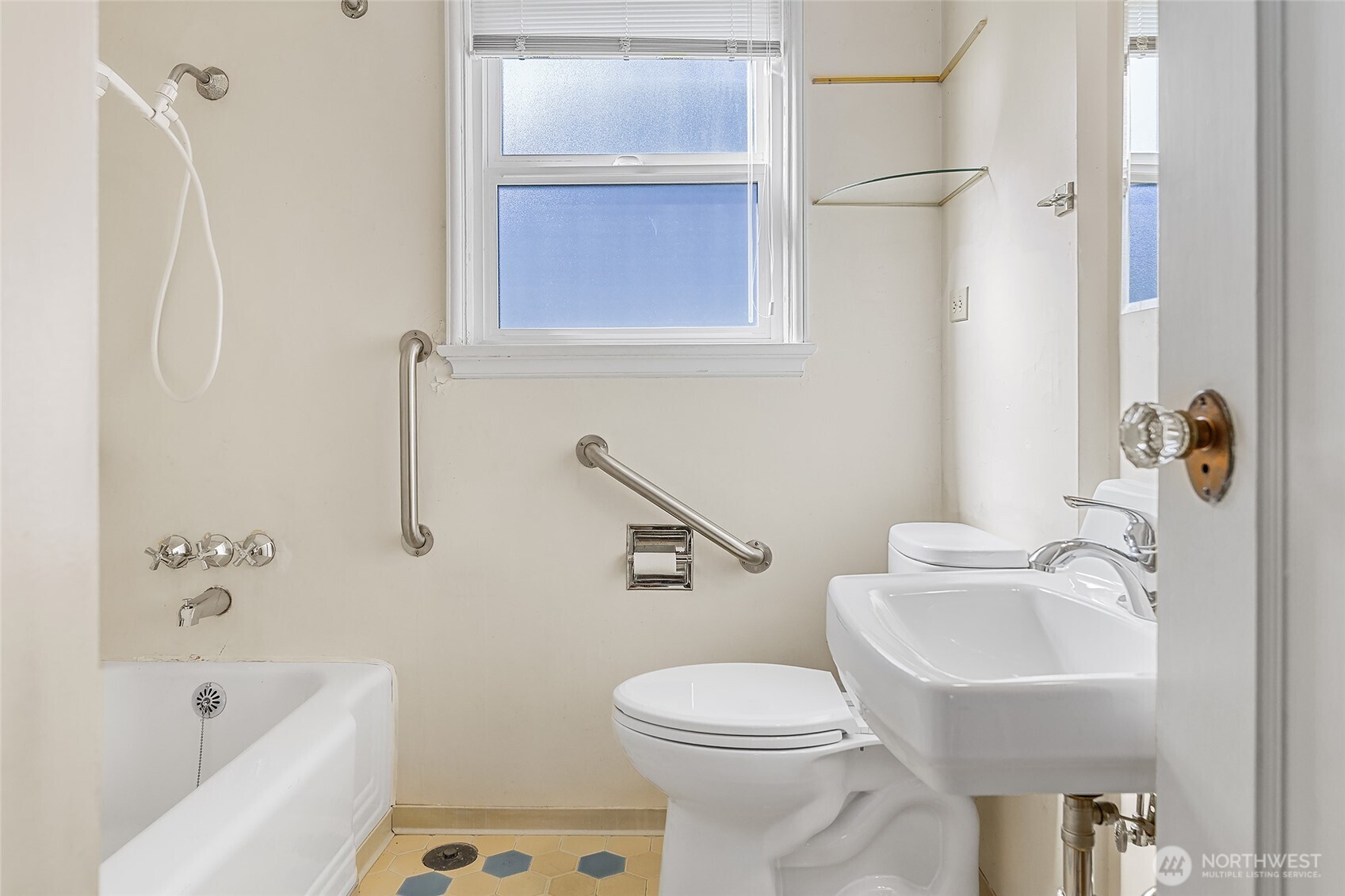 4437 47th Avenue Southwest Seattle, WA 98116 - Photo 19 of 39 a bathroom with a sink a toilet and shower