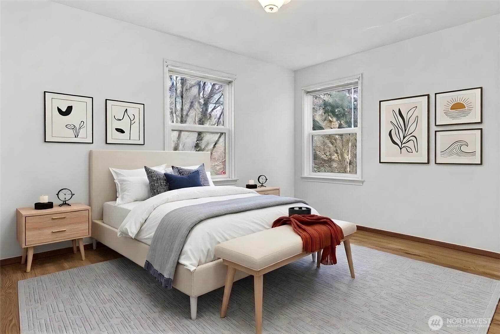 4437 47th Avenue Southwest Seattle, WA 98116 - Photo 24 of 39 a bedroom with a bed and wooden floor