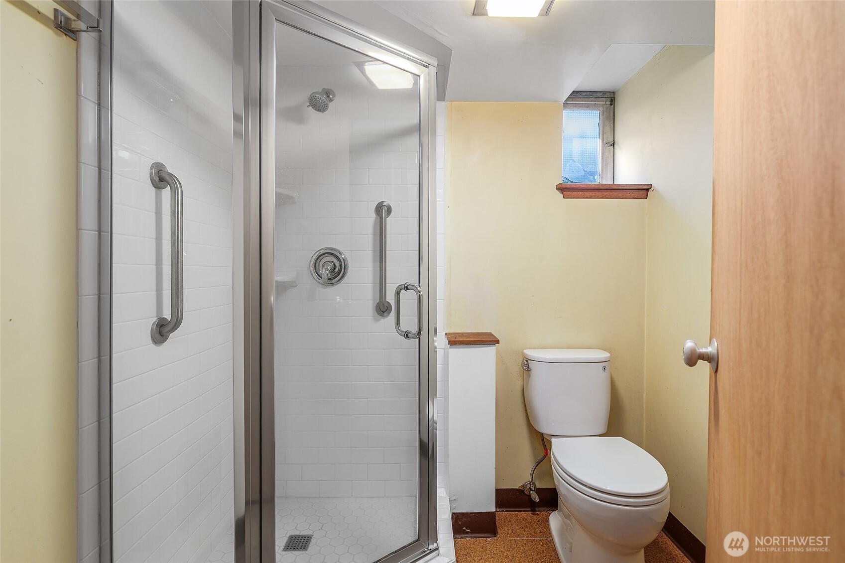 4437 47th Avenue Southwest Seattle, WA 98116 - Photo 32 of 39 a white toilet sitting next to a bathroom sink