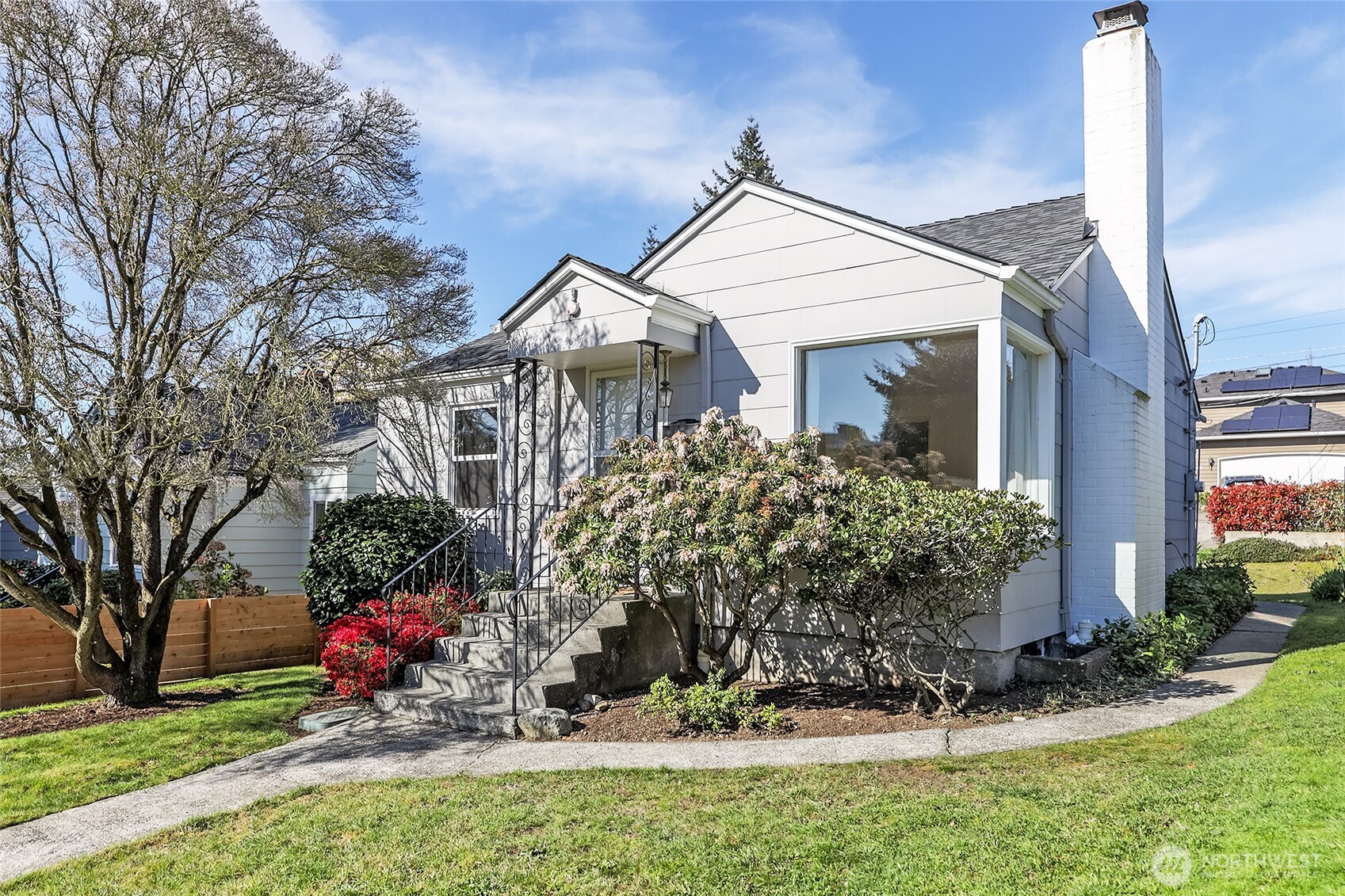 4437 47th Avenue Southwest Seattle, WA 98116 - Photo 39 of 39 a front view of a house with a yard