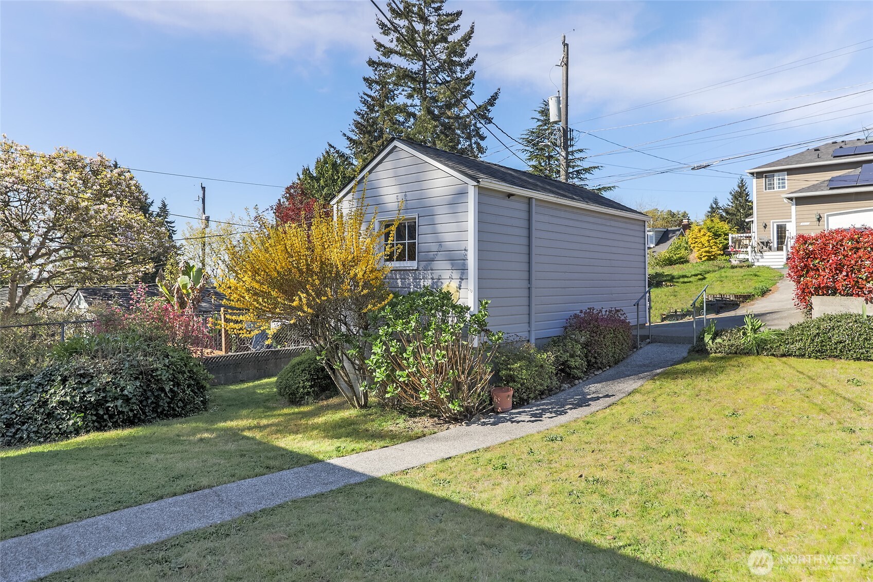 4437 47th Avenue Southwest Seattle, WA 98116 - Photo 4 of 39 a front view of a house with garden