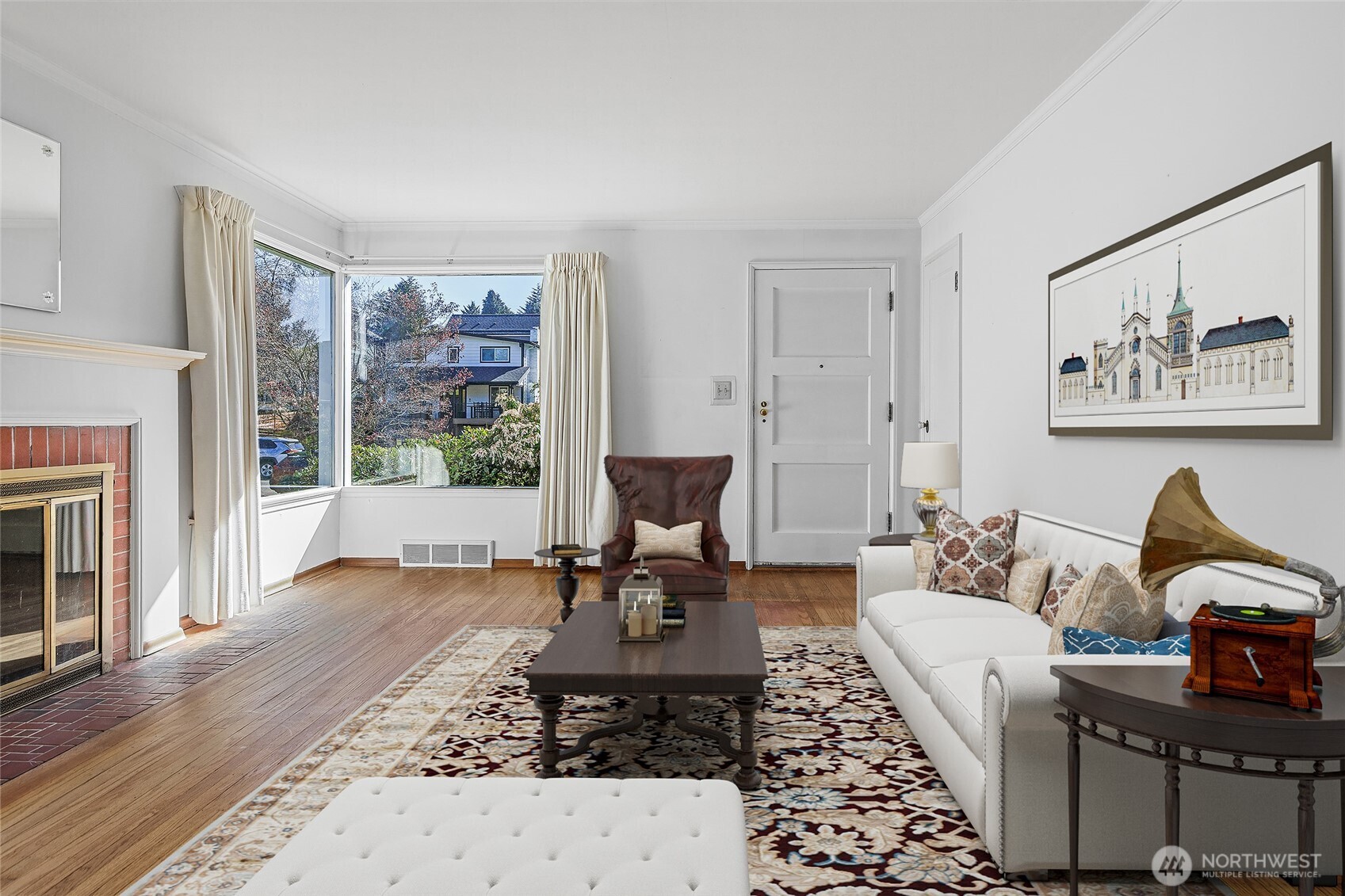 4437 47th Avenue Southwest Seattle, WA 98116 - Photo 10 of 39 a living room with furniture a fireplace and a floor to ceiling window