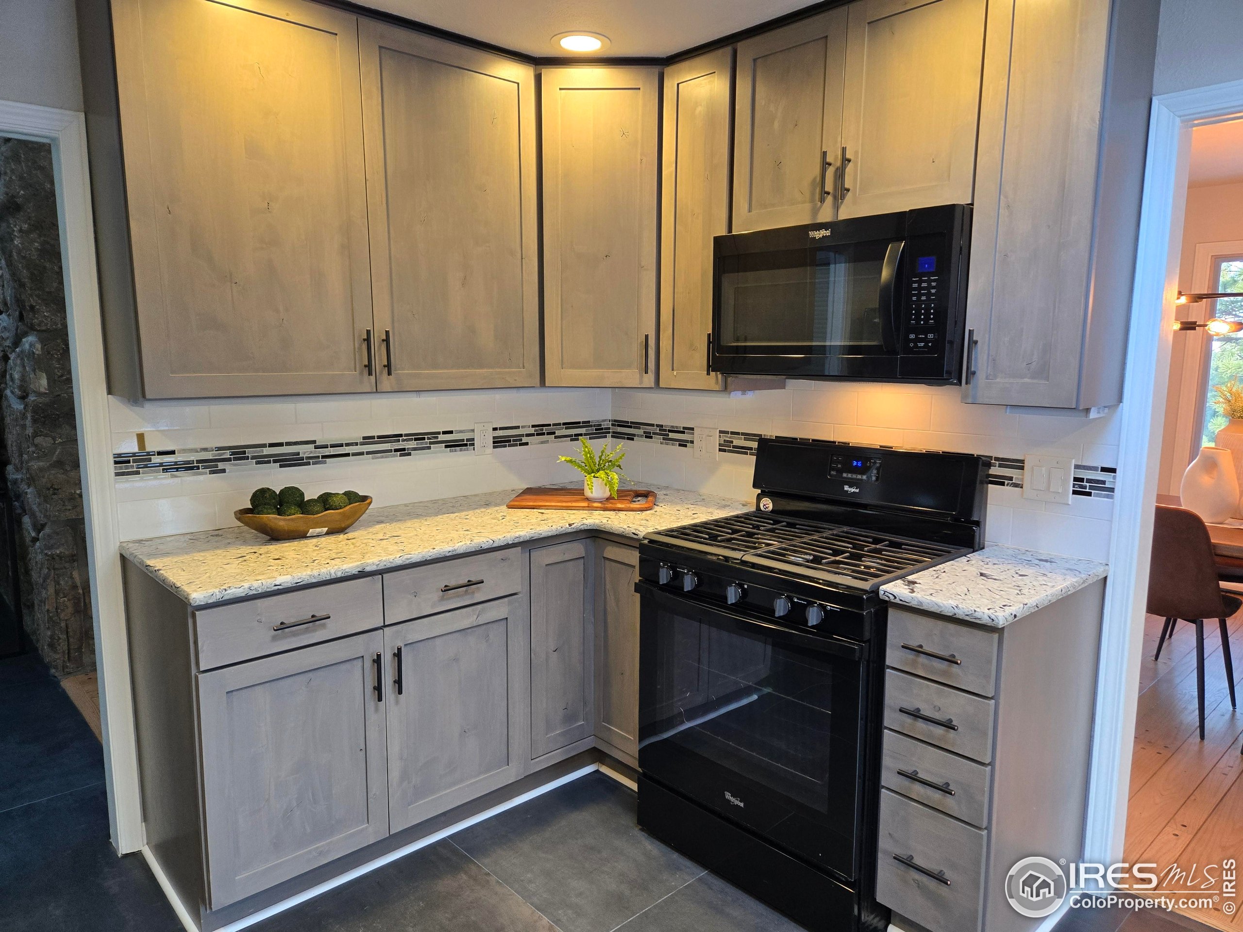 76 Pine Tree Lane Boulder, CO 80304 - Photo 13 of 49 a kitchen with a stove and a microwave