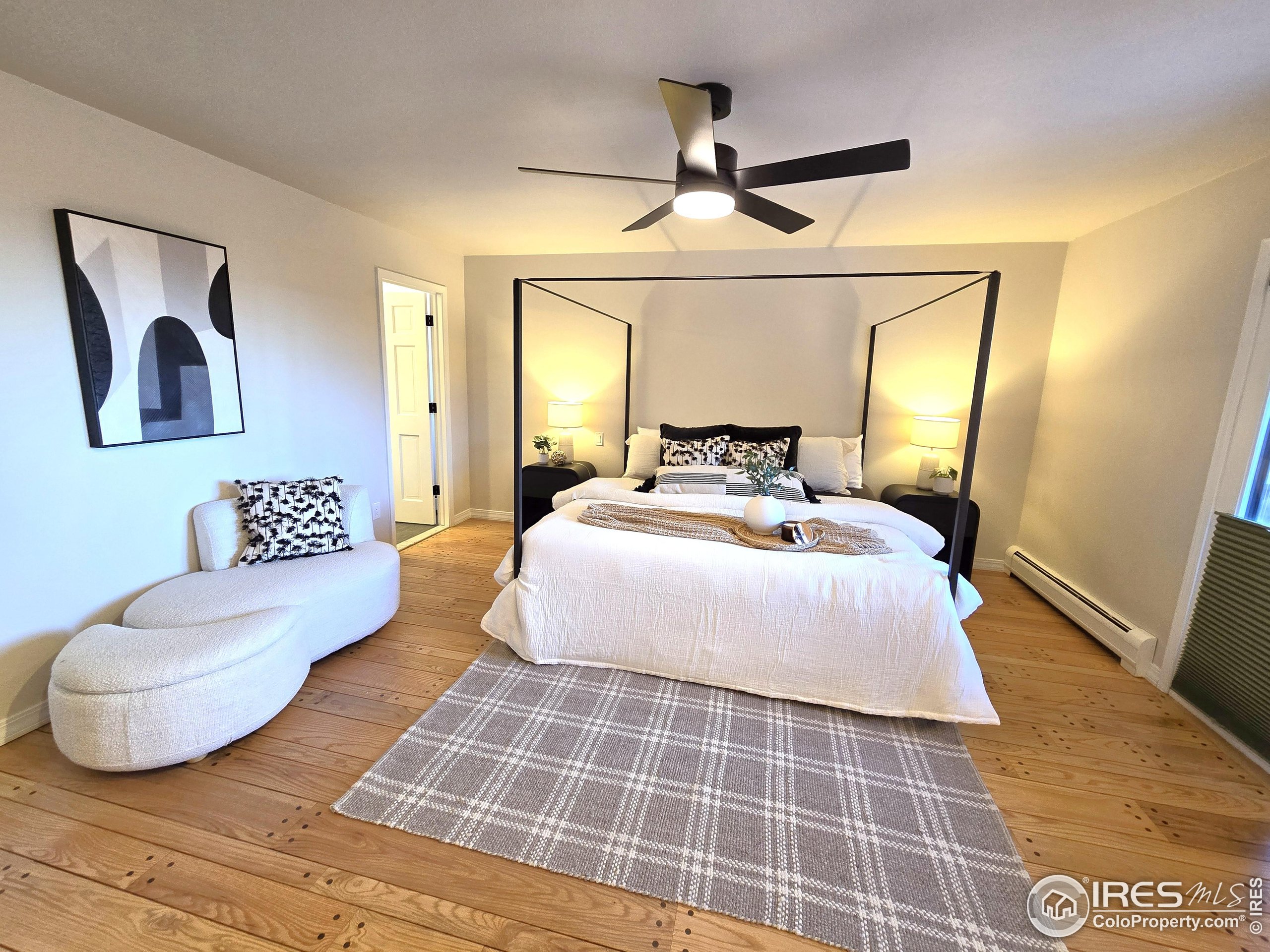 76 Pine Tree Lane Boulder, CO 80304 - Photo 15 of 49 a bedroom with a large bed and a couch