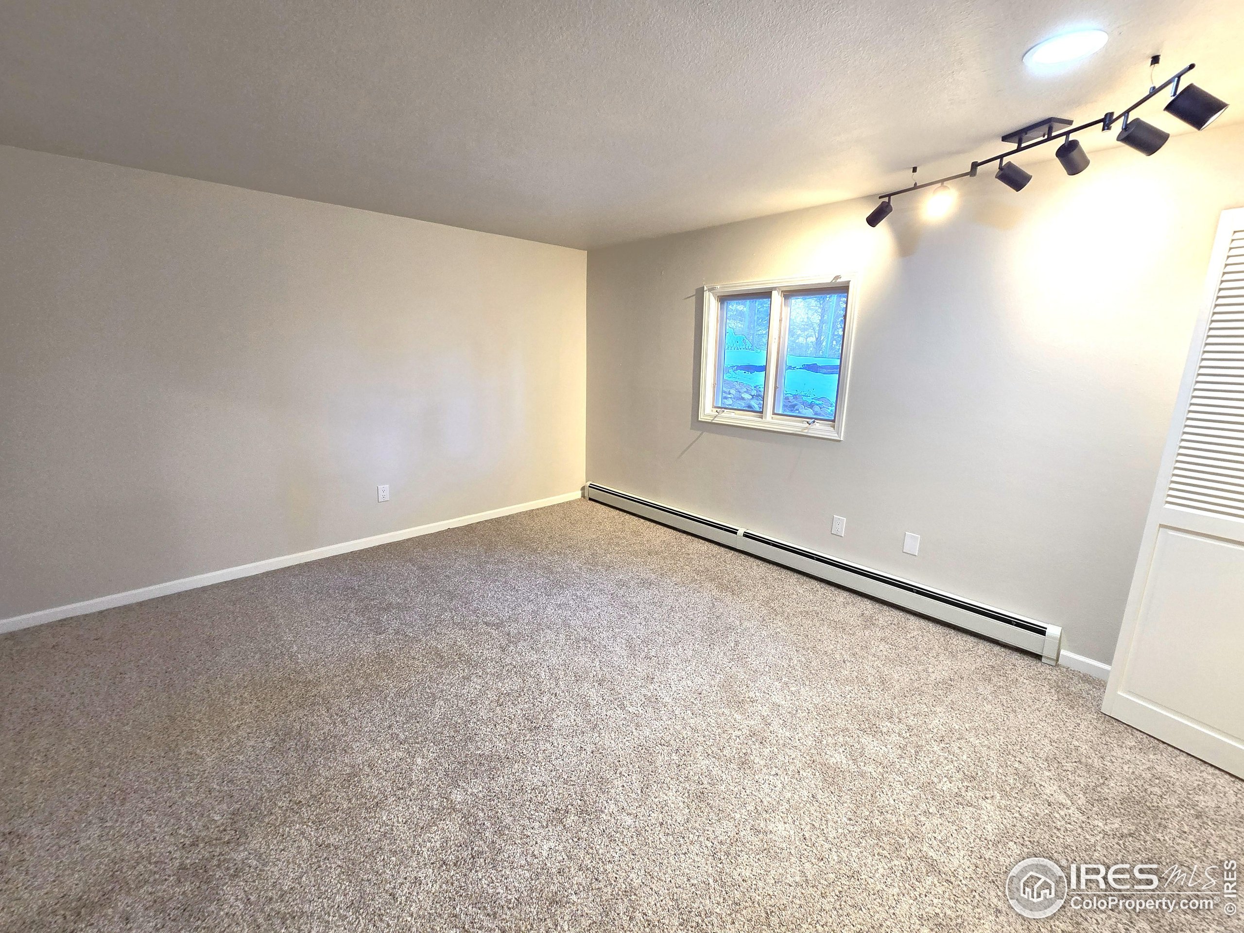 76 Pine Tree Lane Boulder, CO 80304 - Photo 18 of 49 a view of an empty room with a window