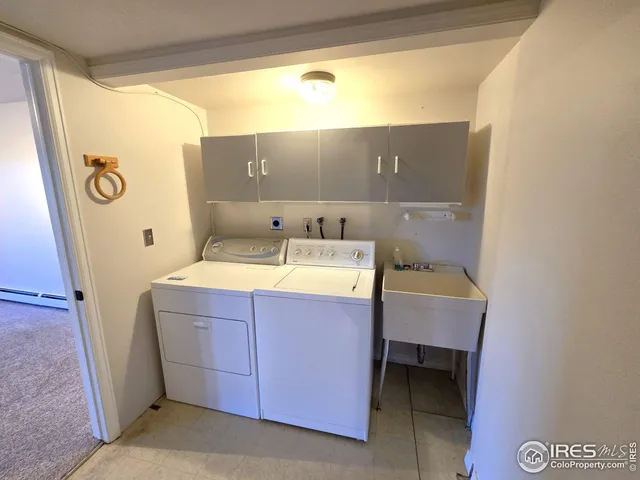 a bathroom with a sink a mirror and a bath tub