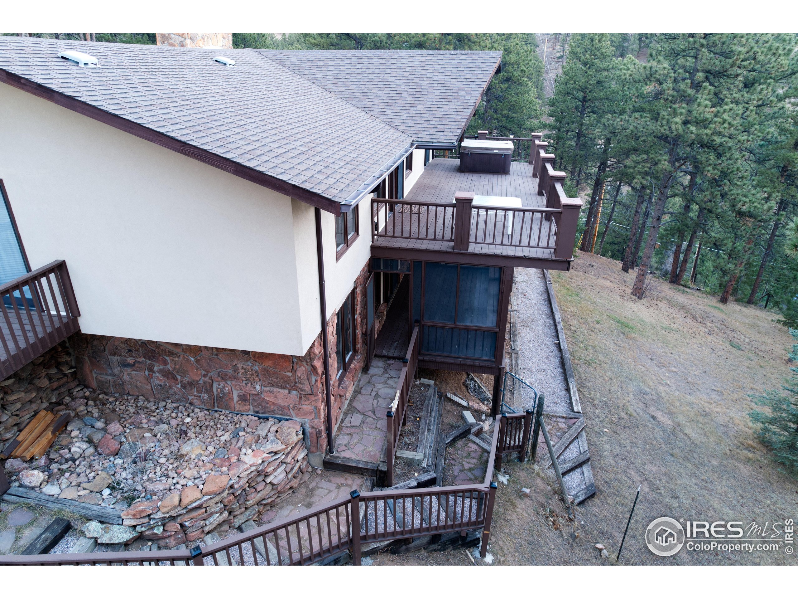 76 Pine Tree Lane Boulder, CO 80304 - Photo 40 of 49 a roof deck view with table and chairs and wooden floor