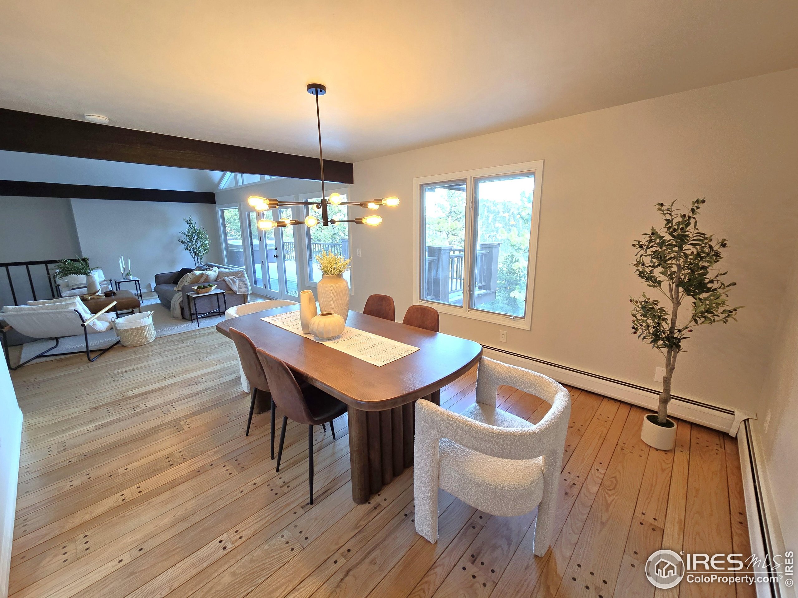 76 Pine Tree Lane Boulder, CO 80304 - Photo 6 of 49 a view of a dining room with furniture window and wooden floor