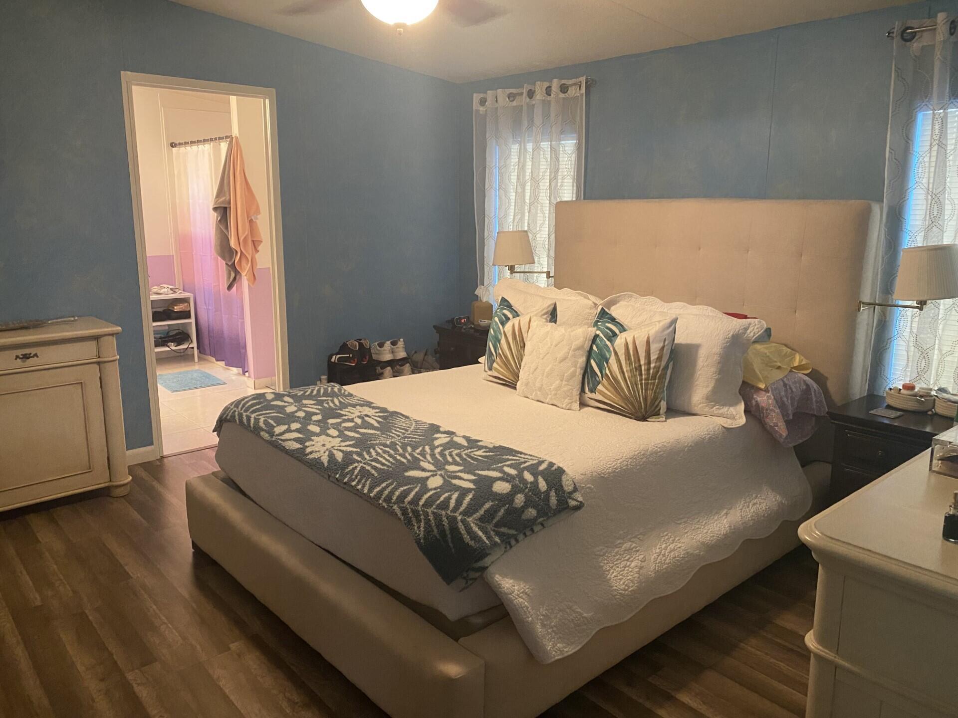 1531 Drexel Road West Palm Beach, FL 33417 - Photo 17 of 35 a bedroom with a bed and a couch