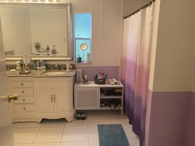 a utility room with cabinets dryer and washer