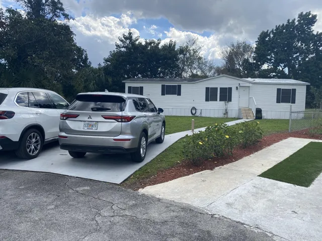 a view of a car parked in front of a house
