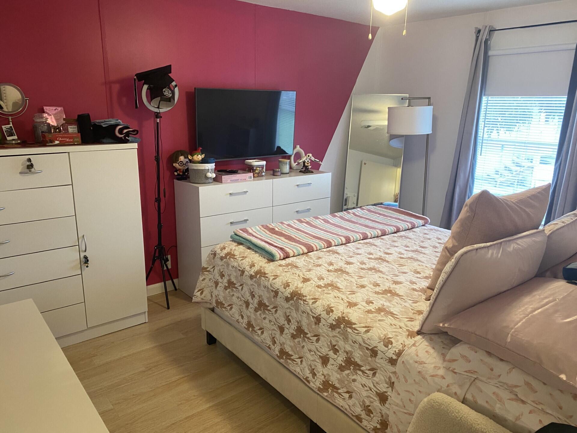 1531 Drexel Road West Palm Beach, FL 33417 - Photo 25 of 35 a bedroom with a bed and a television