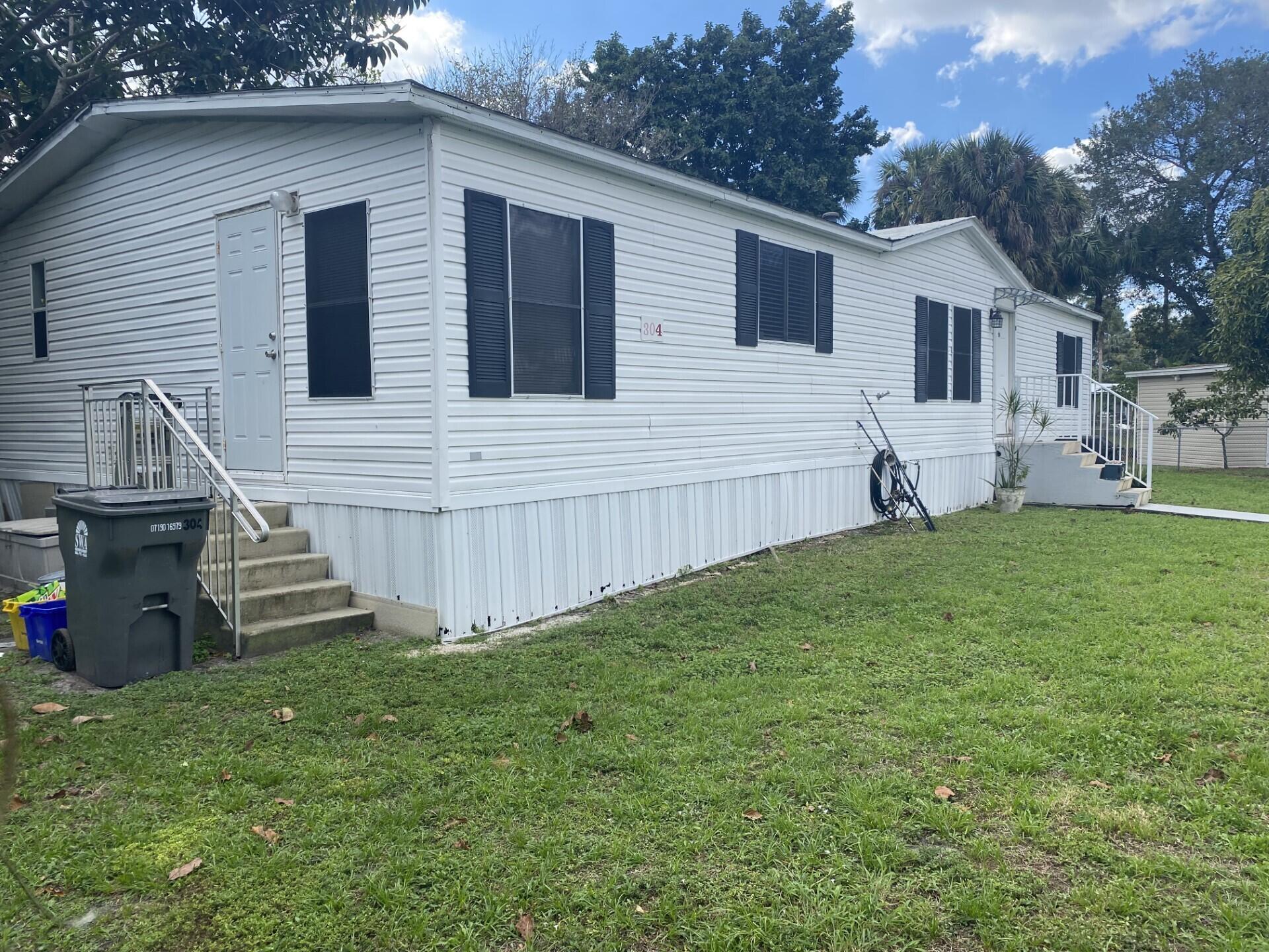 1531 Drexel Road West Palm Beach, FL 33417 - Photo 4 of 35 a view of a house with a yard