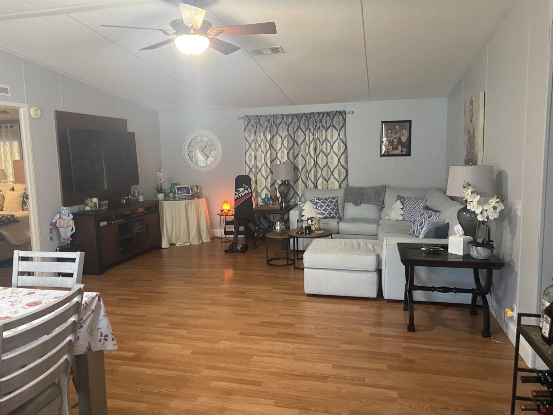 1531 Drexel Road West Palm Beach, FL 33417 - Photo 7 of 35 a living room with furniture and a flat screen tv