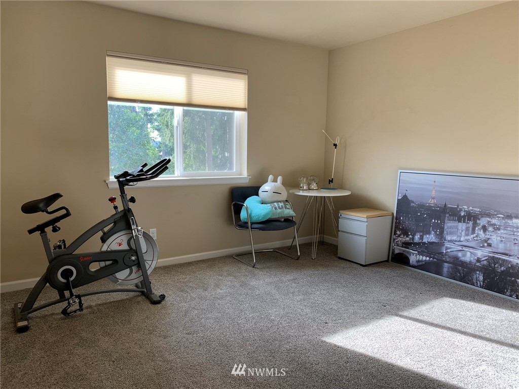 3627 Northeast 6th Street Renton, WA 98056 - Photo 38 of 40 a living room with furniture a air conditioner vent and a window