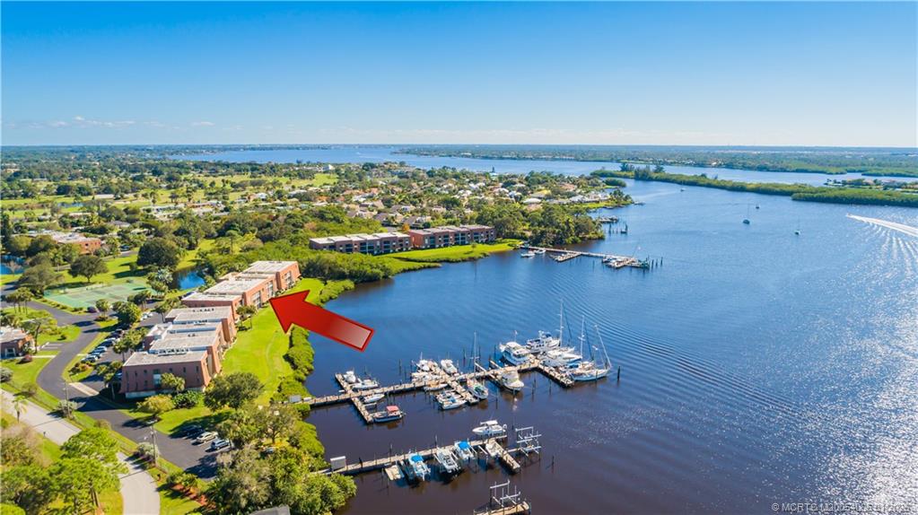 3100 Southeast Pruitt Road, Unit G205 Port St. Lucie, FL 34952 - Photo 2 of 29 an aerial view of a houses with an outdoor space
