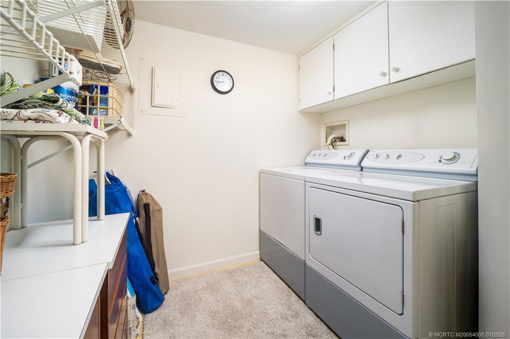 3100 Southeast Pruitt Road, Unit G205 Port St. Lucie, FL 34952 - Photo 22 of 29 a utility room with dryer and washer