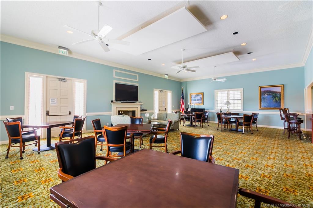 3100 Southeast Pruitt Road, Unit G205 Port St. Lucie, FL 34952 - Photo 26 of 29 a living room with lots of furniture and kitchen view