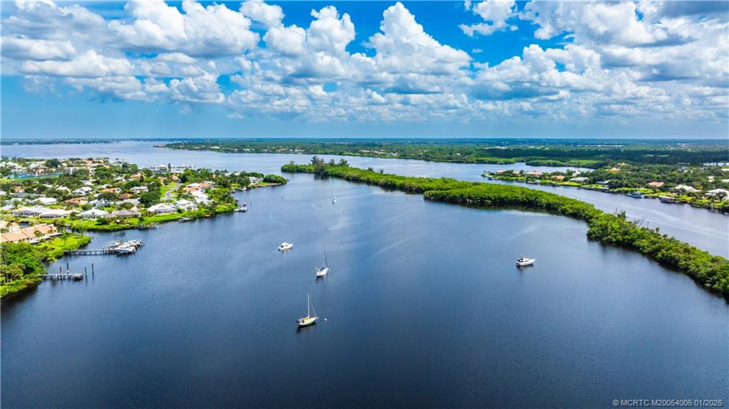 3100 Southeast Pruitt Road, Unit G205 Port St. Lucie, FL 34952 - Photo 5 of 29 a view of a lake with a outdoor space